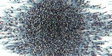 Large crowd of people seen from above coming together to invest in a crowdfunding project / business