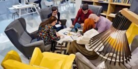 A team working out of the chill area of a business incubator