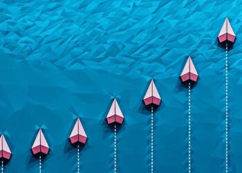 A series of paper lines flying above a blue ocean, with one in bright red symbolising the best exit strategy