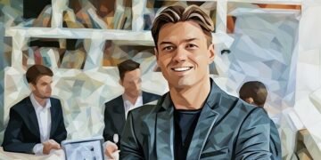 Front shot of a happy startup founder with a series of colleagues in the background