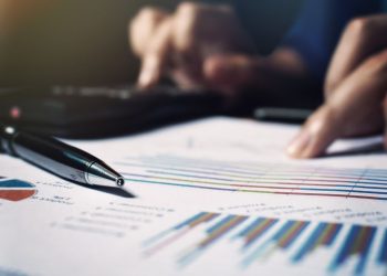 An entrepreneur working out the margins and profits he can make on his business