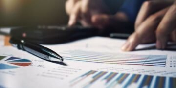 An entrepreneur working out the margins and profits he can make on his business