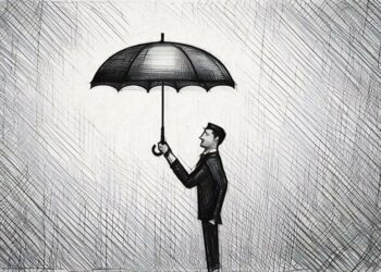 Insurance man in a black suit holding an umbrella symbolsing the protection business insurance can provide for small companies