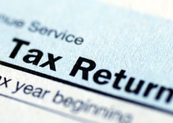 Tax return close up with a marked deadline looming for when tax fees are due