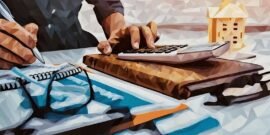 Business owner surrounded by tax paperwork and doing business tax calculations for the annual accounts