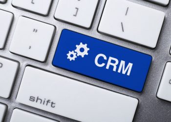 A key on a keyboard saying CRM and highlighted blue