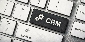 A key on a keyboard saying CRM and highlighted blue