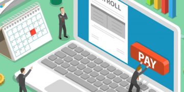 Tony businessman using a computer to calculate and make payroll payments to employees and the HMRC