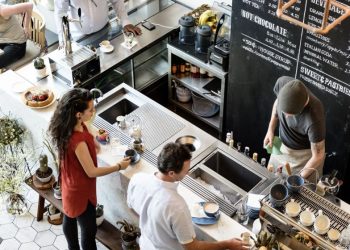 Image of a busy coffee shop counter as an example of a non-technology based business