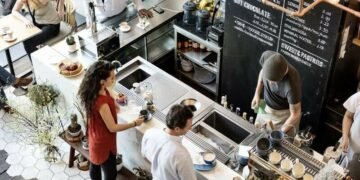 Image of a busy coffee shop counter as an example of a non-technology based business