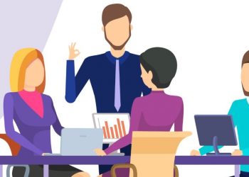 A group of employees sitting around a table whilst a manager engages with them