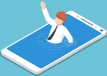 An entrepreneur drowning in a smartphone, as an example of how overwhelming a social media crisis can be