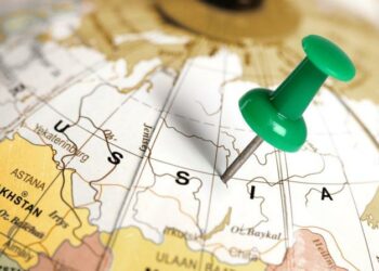 A geographic map of Russia on a globe with a pin centre in Russia, show businesses where Russia is