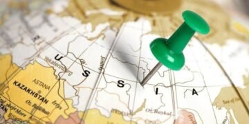 A geographic map of Russia on a globe with a pin centre in Russia, show businesses where Russia is