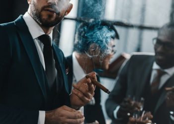 Billionaires drinking whiskey and living a generally lavish lifestyle