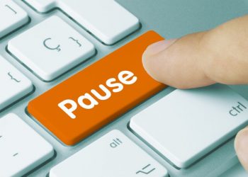 Pause button representing stopping and thinking about how to make the office stress free