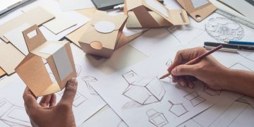 A designer designing product packaging used for marketing