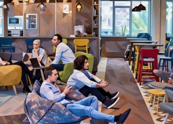 Two colleagues playing computer games at work as an example of how playing at work can be productive