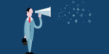 A businessman using a megaphone to communiicating that is spitting out random letters as an example of one method of communication