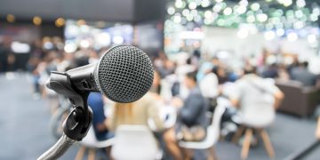 Closeup of a microphone at a public speaking event