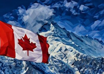 Canadian flag flying over a mountain, symbolising Canada
