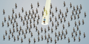 Hundreds of potential candidates with a spotlight on one in brighter colours,, showing how recruitment agencies can fight through the noise and find the right candidate