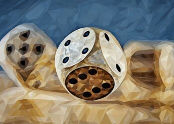 Balancing dice symbolising the chance of getting business funding