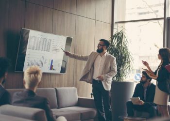 A business leader giving sales presentation using his brilliant techniques