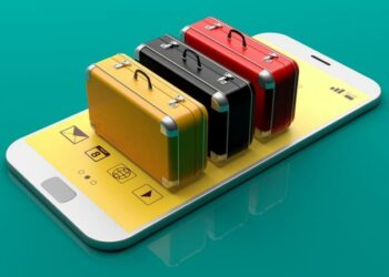 A series of suitcases on top of a smartphone as an existential idea of smart luggage