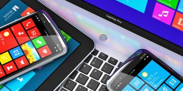 Sewries of Microsoft devices lying on a table