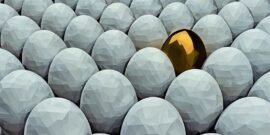 Golden egg in white eggs representing a valuable business