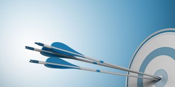 Arrows in the bulls-eye of a target, symbolising achieving marketing objectives