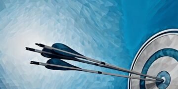Arrows in the bulls-eye of a target, symbolising achieving marketing objectives