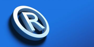 An "R" with a circle around being the symbol for a trademark, set onto a royal blue background