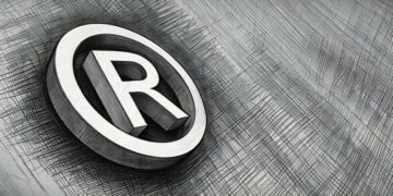 An "R" with a circle around being the symbol for a trademark, set onto a royal blue background