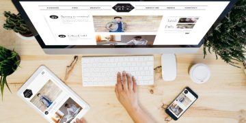 Blogger using her apple computer to write and publish a new blog post