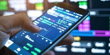 An investor using a smartphone application to trade oil shares online