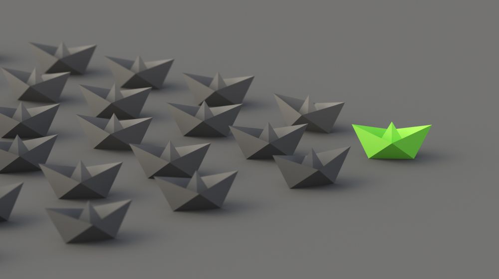 A series of paper boats on a grey background, with one highlighted in green showing the difference between a qualified lead and normal lead