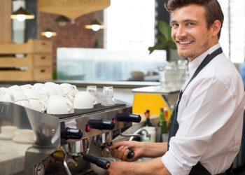 Small business owner whose happy to have received financing for his new cafe business