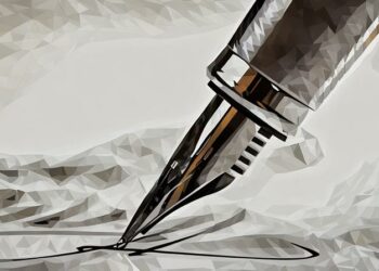 Closeup of a fountain pen writing on paper, showing how someone can improve their writing skills