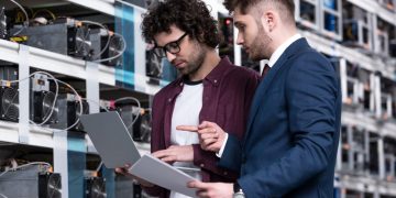 A business manager and IT manager exploring purchasing IT equipment