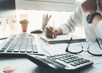 Bookkeeper or financial inspector hands making report, calculating. Home finances, investment, economy, saving money or insurance concept