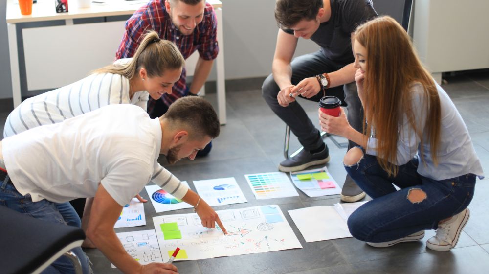 Students in a group planning to start a business at University