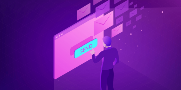 Man pressing a big send button on a new email marketing software solution