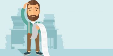 Entrepreneur holding a huge list of due bills and scratching his head as to how far he is in debt