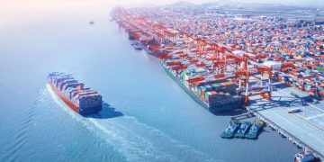 Container ship leaving the port,aerial view.