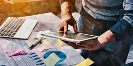 Entrepreneur using a tablet to access digital customer records to use for targeting purposes
