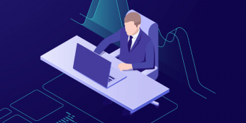 Digital marketer sitting at a desk using an online course to improve his marketing skills