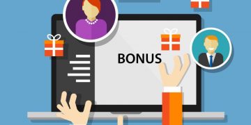 Presents surrounding a laptop and profile photos of employees, with bonus written on the laptop as an example of an employee benefits scheme feature