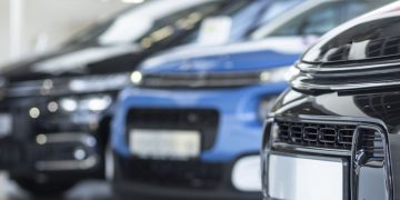 A series of cars with empty number plates as example of business vehicles ready to purchase